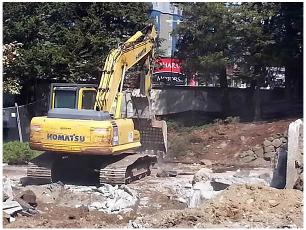 A backhoe digging dirt.